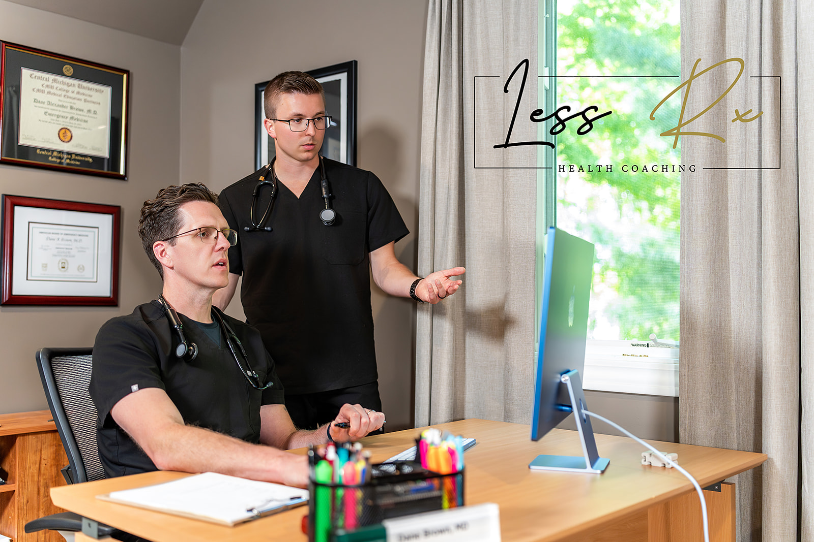Doctors discussing lifestyle medicine on a laptop